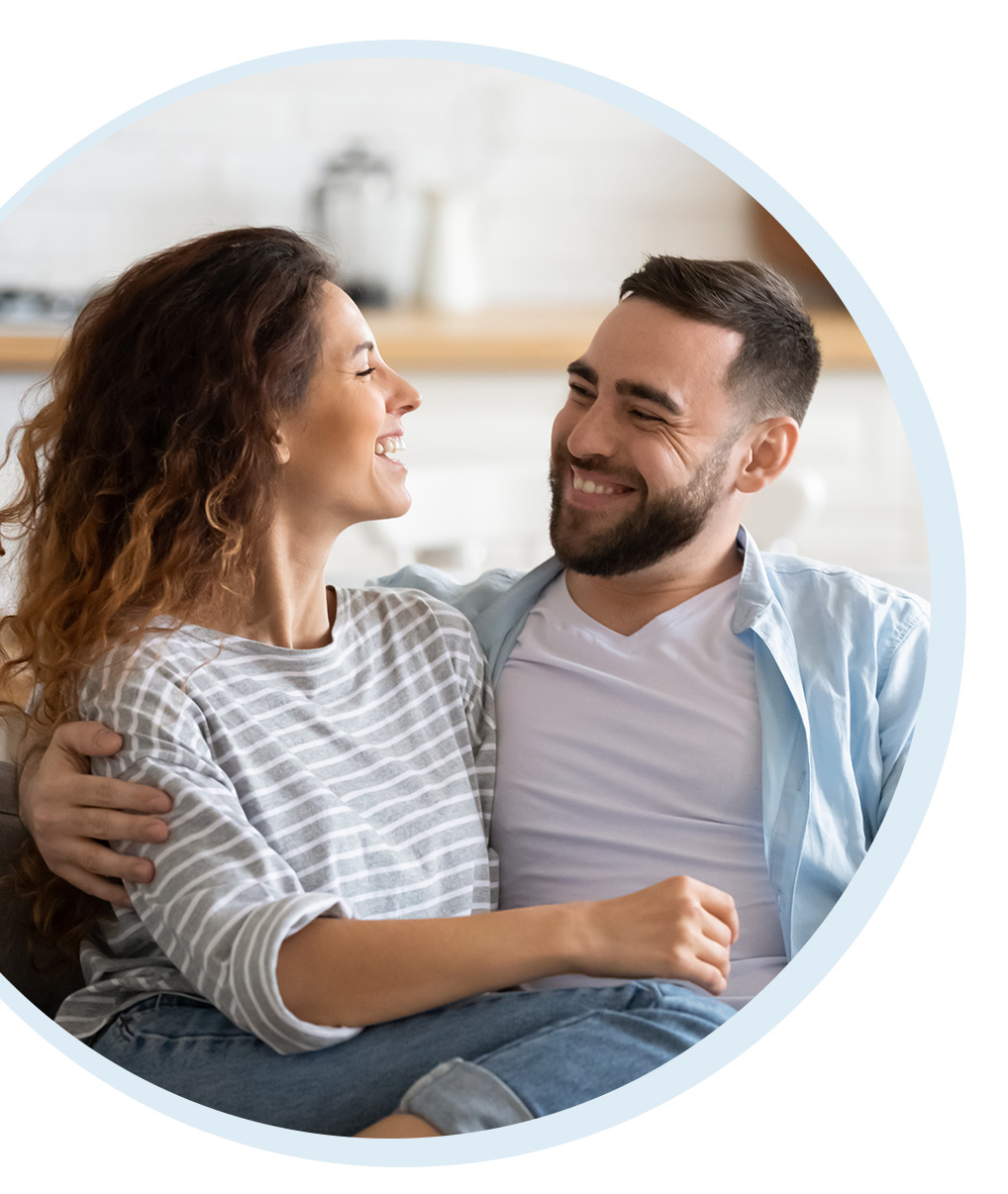 Couple smiling at each other after online relationship therapy in Louisiana